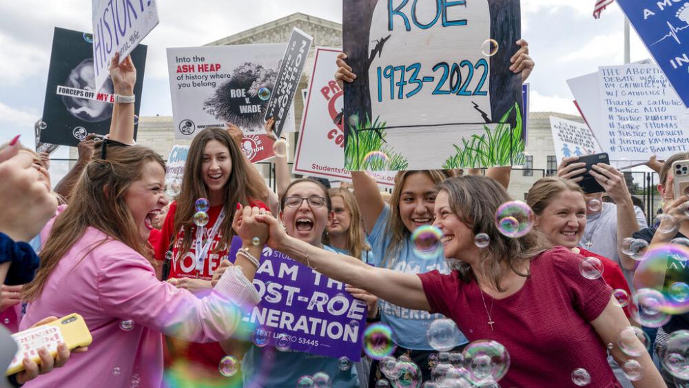 Pro-lifers celebrate the Supreme Court&#039;s decision to overturn Roe v. Wade, outside the Supreme Court in Washington, June 24, 2022. (AP Photo/Gemunu Amarasinghe)