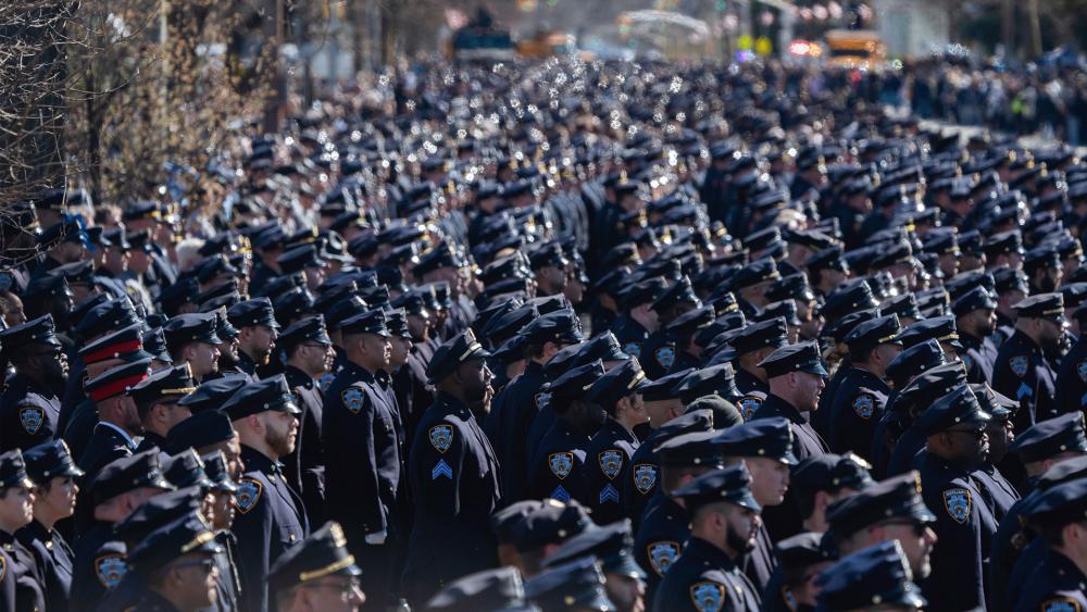 Police officers gather during a funeral service for NYPD officer Jonathan Diller at Saint Rose of Lima R.C Church in Massapequa Park, NY, on March 30, 2024. (AP Photo/Jeenah Moon)