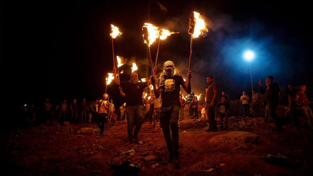 Palestinian demonstrators. Photo Credit: Majdi Mohammed, AP
