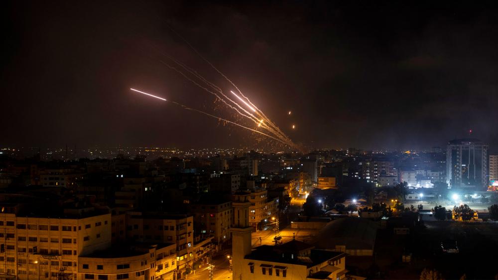 Rockets are launched from the Gaza Strip towards Israel, Wednesday, May 12, 2021. (AP Photo/Khalil Hamra)
