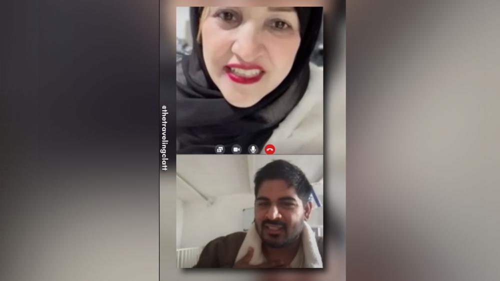 Israeli social media influencer Tal Oran speaking to Gazan woman. Photo Credit: Screenshot, @TheTravelingClatt, Youtube.