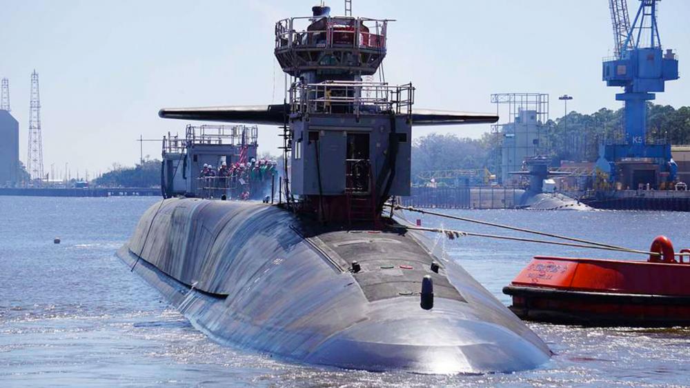 The Ohio-class guided-missile submarine USS Georgia (SSGN 729) exits the dry dock at Naval Submarine Base Kings Bay, Ga. Photo Credit: NARA &amp; DVIDS Public Domain Archive.