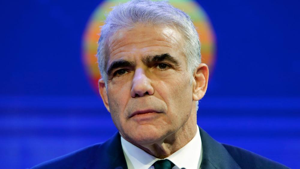 In this March 24, 2021 file photo, Yesh Atid party leader Yair Lapid delivers a speech. (AP Photo/Sebastian Scheiner, File)